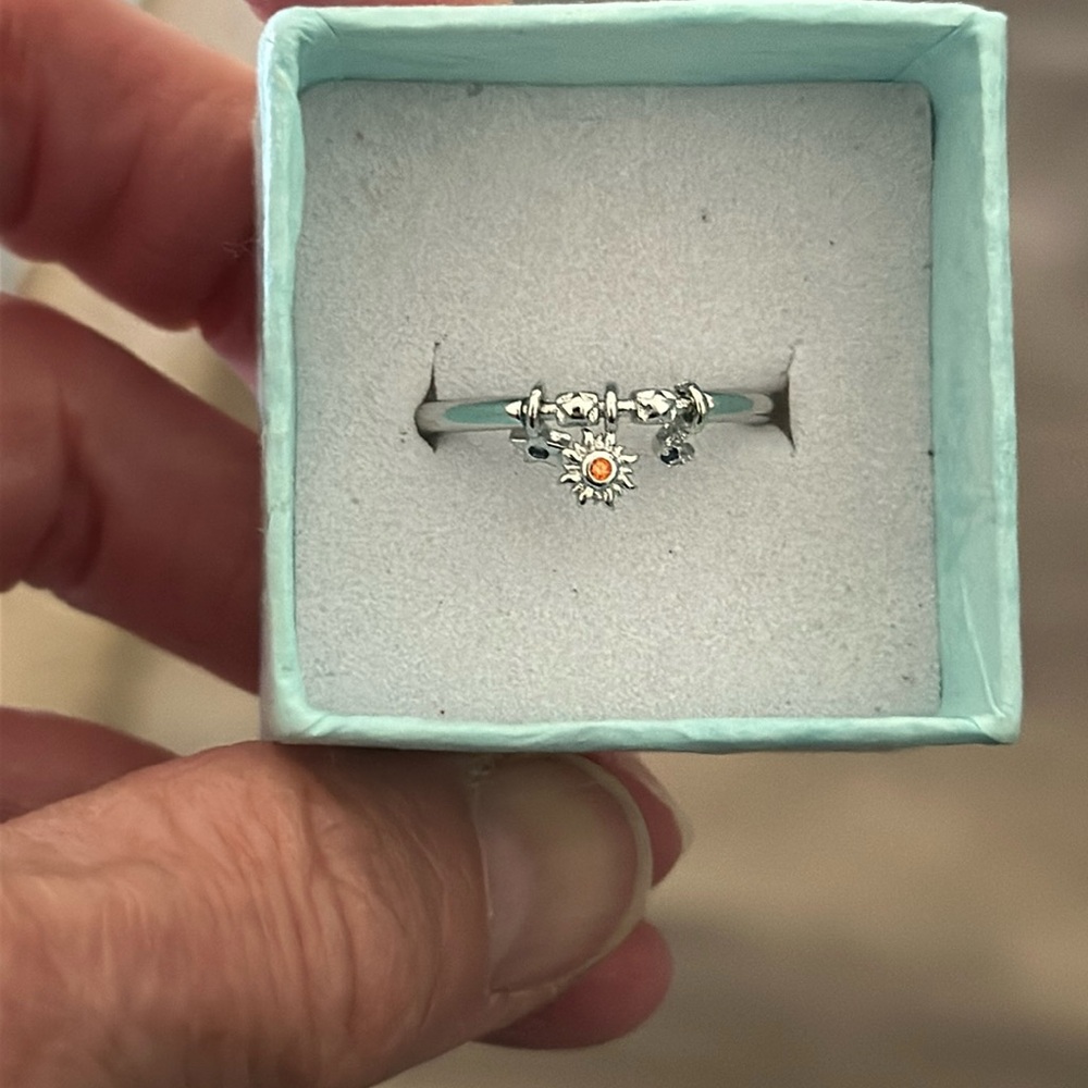 Cute sterling silver ring with a star, moon and sun that move